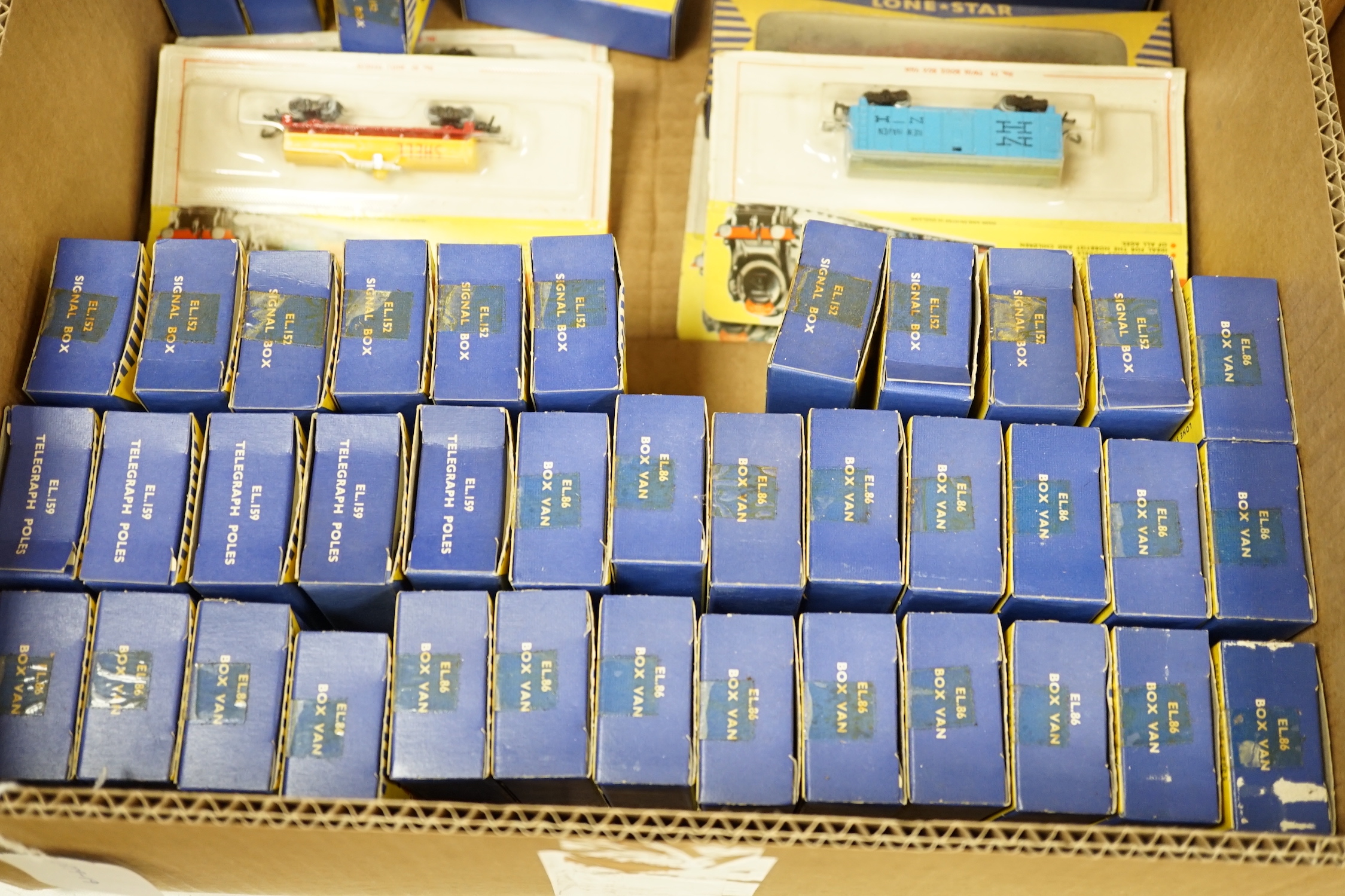 Seventy-two boxed items of Lone Star 000 gauge model railway including; a tunnel, Brake End Coaches, bogie wagons, station platforms, platform extensions, signal boxes, box vans, and telegraph poles
